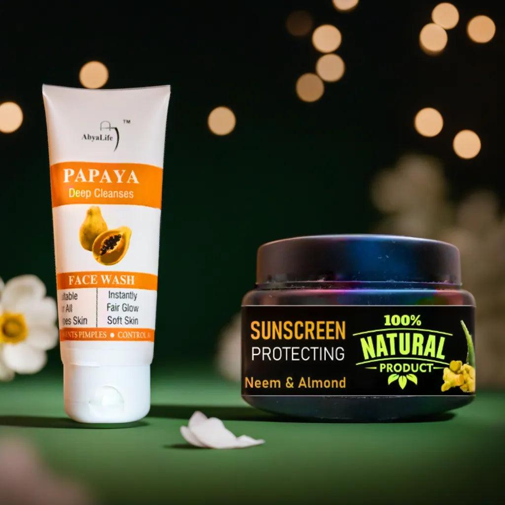 Close-up of AbyaLife face wash products, Papaya and Neem, with a discount message for using UPI payments. Pink and purple flowers are visible in the background.